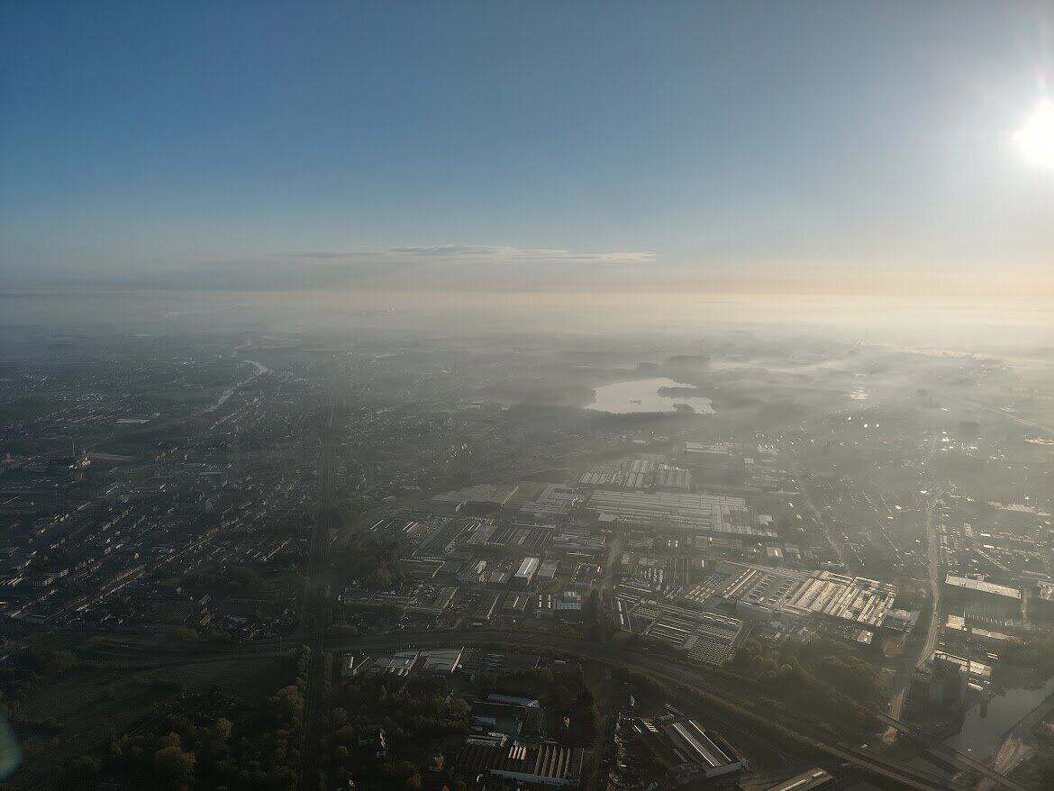 Morning mist over the Flemish landscape seen from a hot-air balloon